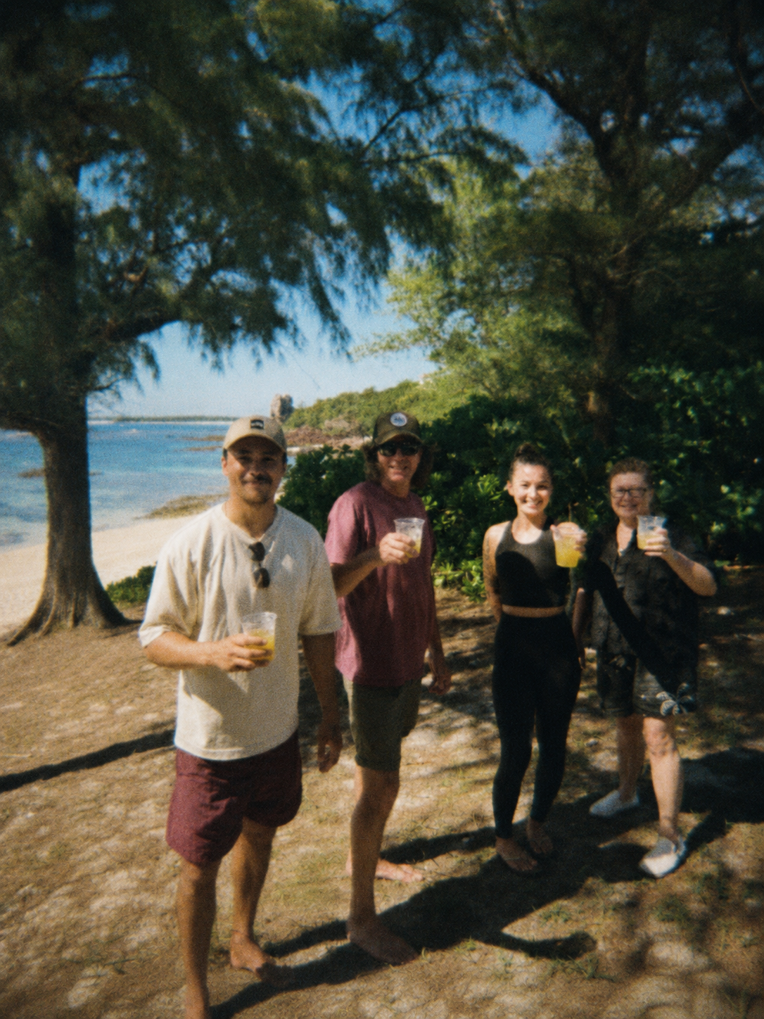 Guests with pressed sugar cane on tour in Okinawa