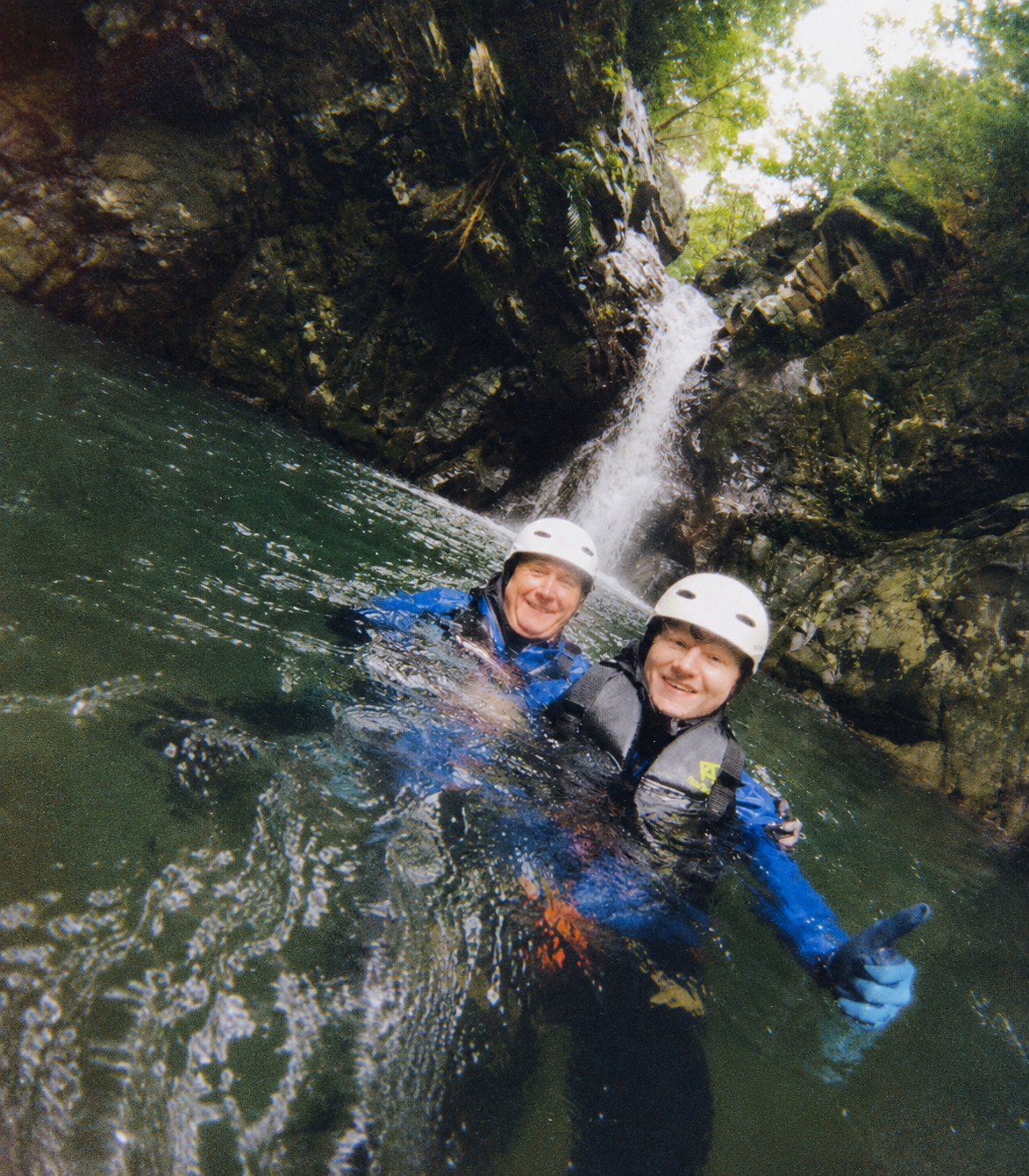 Father and son on waterfall trekking tour in Okinawa